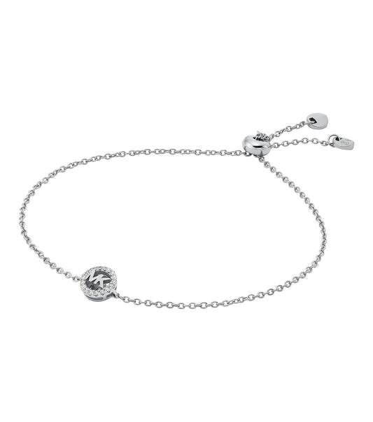 Effortlessly elegant Michael Kors silver bracelet at a dramatic angle, showcasing its sparkling charm and sleek design.